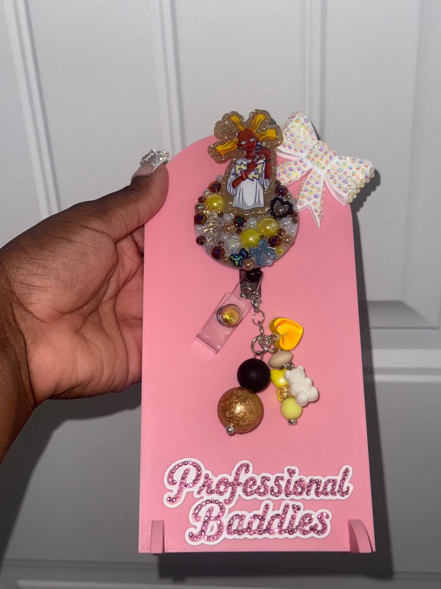 Brown Cynthia boujee junk badge reel
