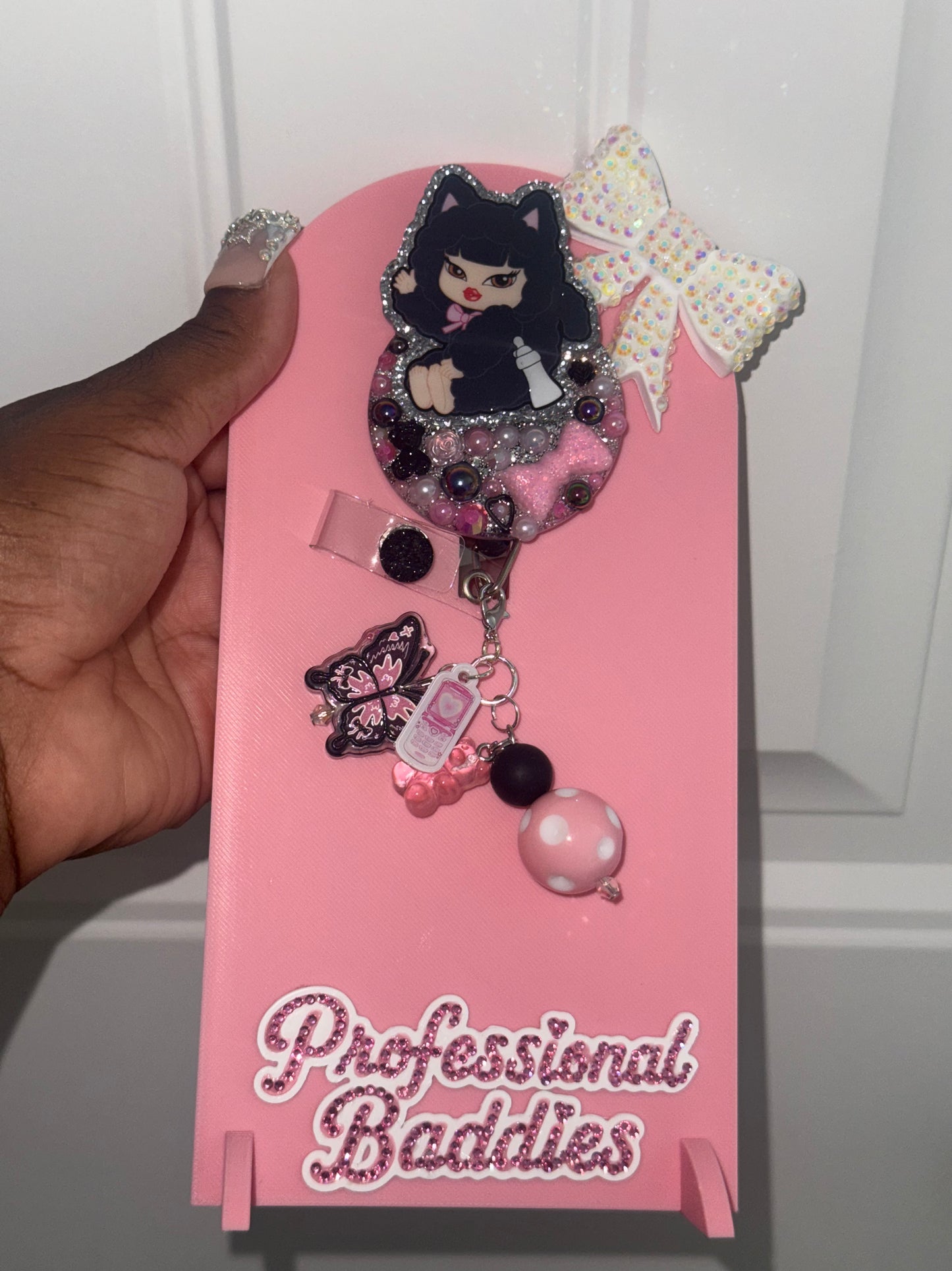 Brat baby wearing black  boujee junk badge reel